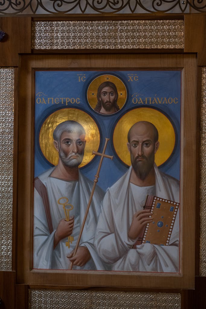 Traditional Orthodox icon featuring saints on a vibrant blue background.