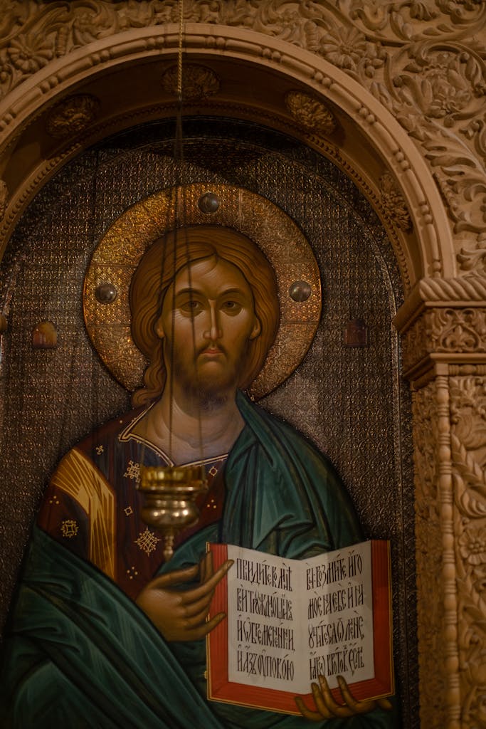 A classic Orthodox icon depicting Jesus Christ with an ornately carved frame in warm tones.