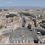 Panoramic aerial shot of St. Peter's Square in Vatican City, capturing the iconic elliptical colonnade.